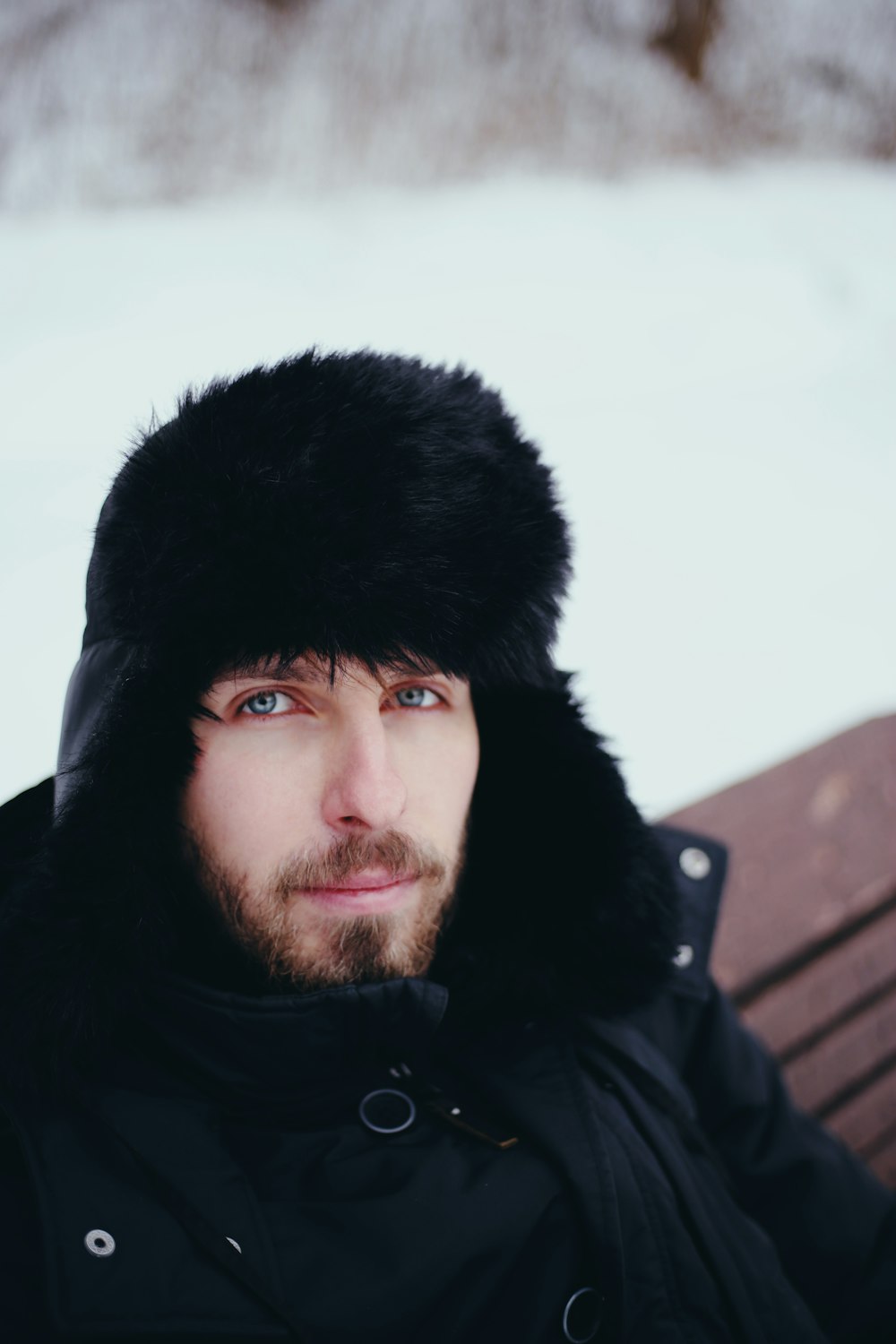 man in black knit cap and black jacket