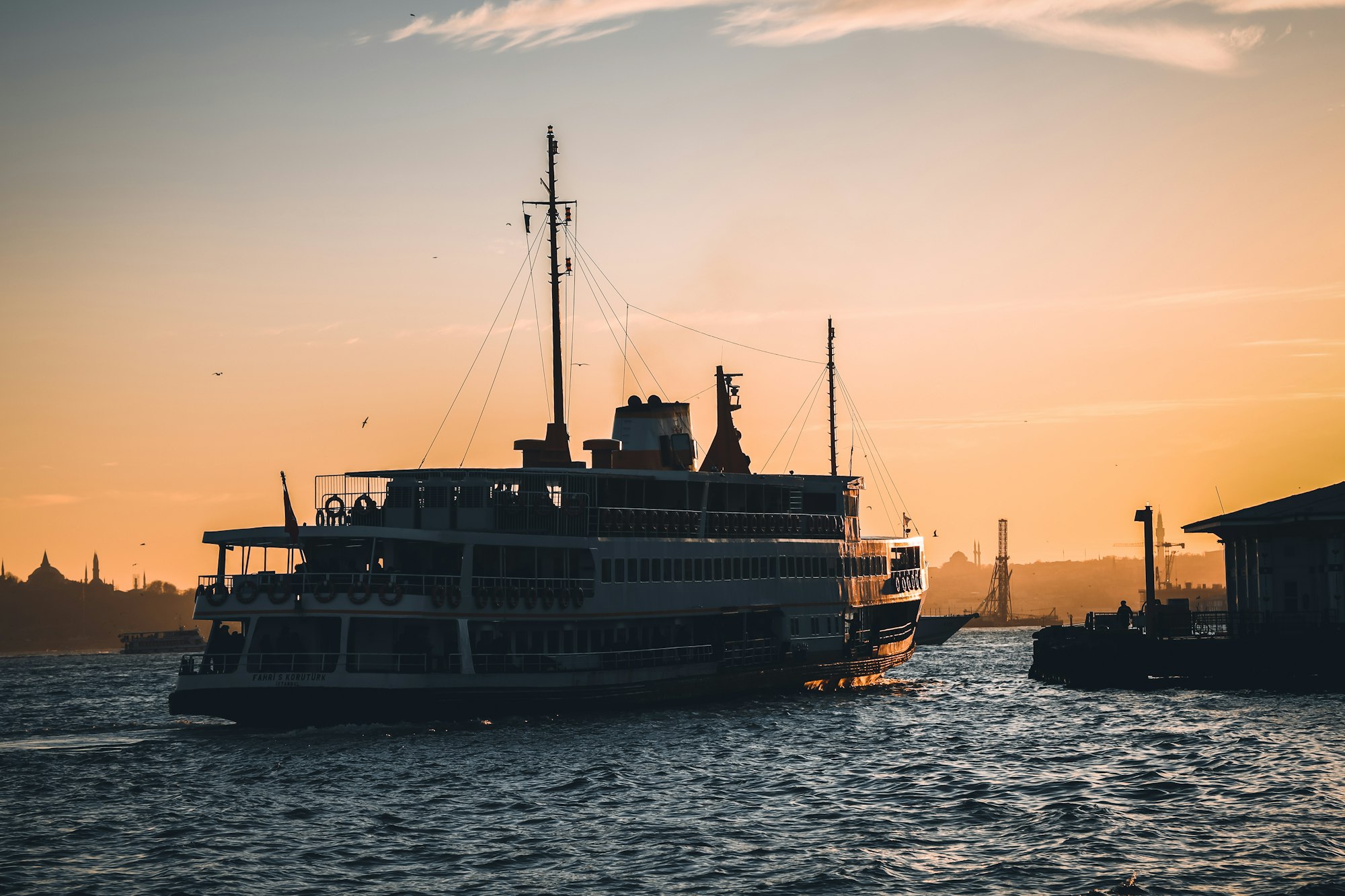 At sunset the ferry leaves Beşiktaş port