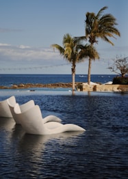 white concrete building near body of water during daytime