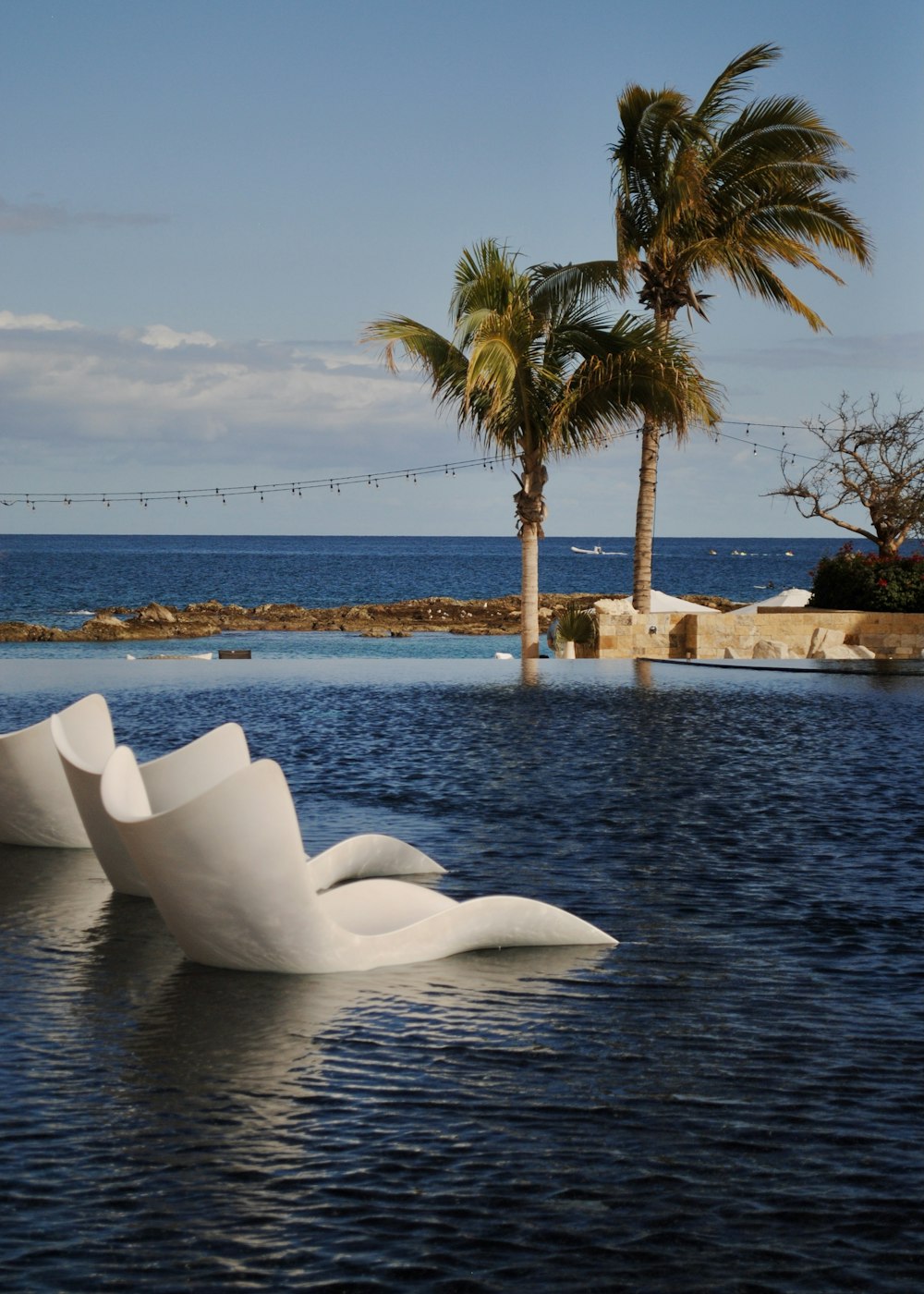 white concrete building near body of water during daytime