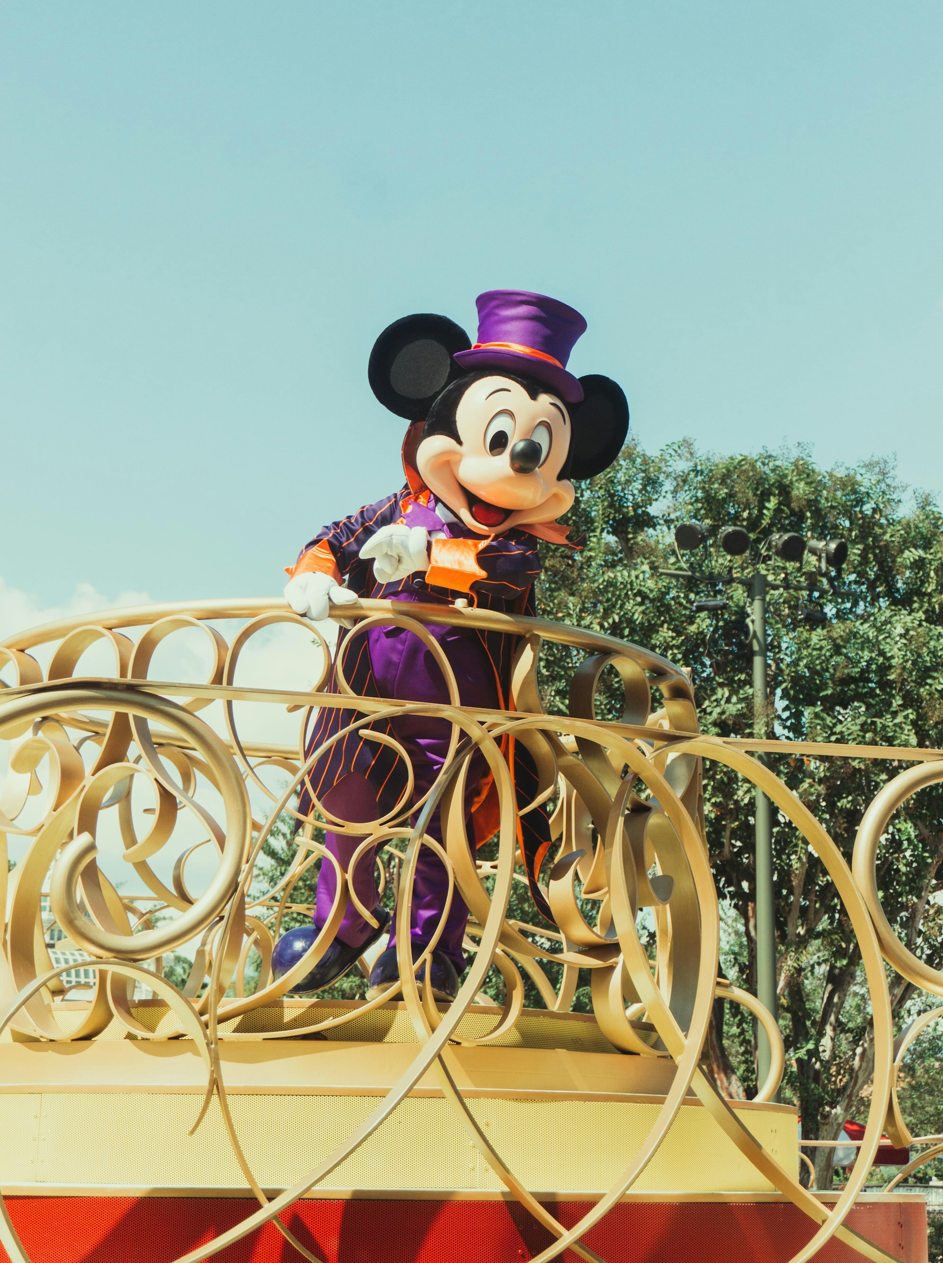 mickey mouse riding on yellow horse