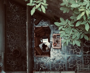 A remote worker video conferencing from a sunny outdoor patio.