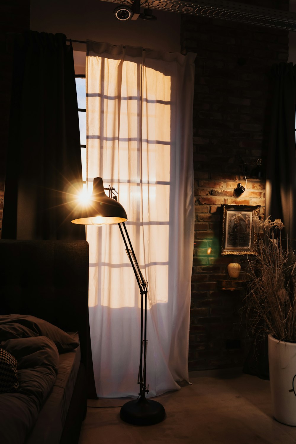 black floor lamp near window