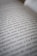A close-up view of text on a book page, showing several lines of Spanish writing in black ink on white paper. The camera focus creates a soft blur effect on parts of the text.