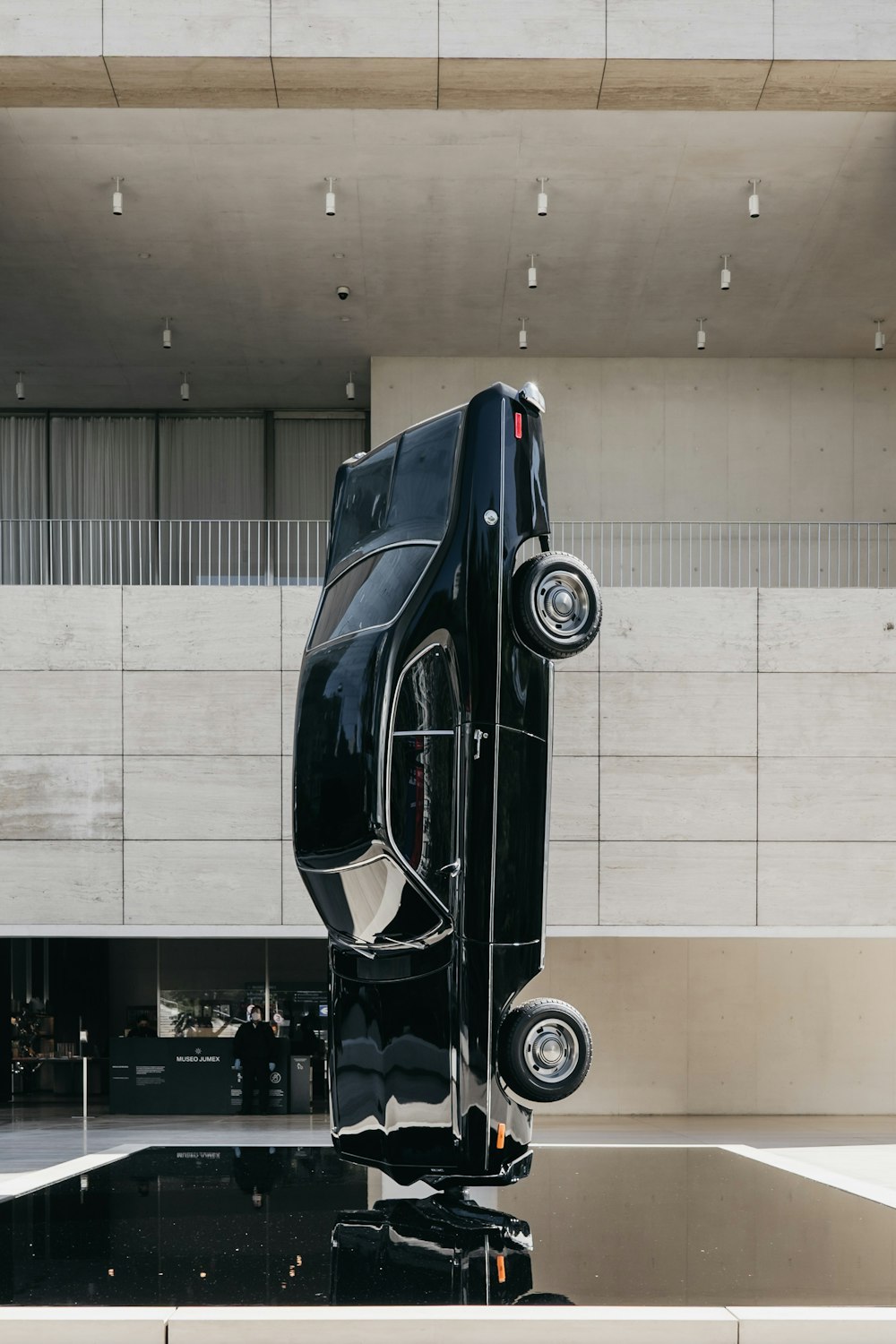 black car parked in front of building