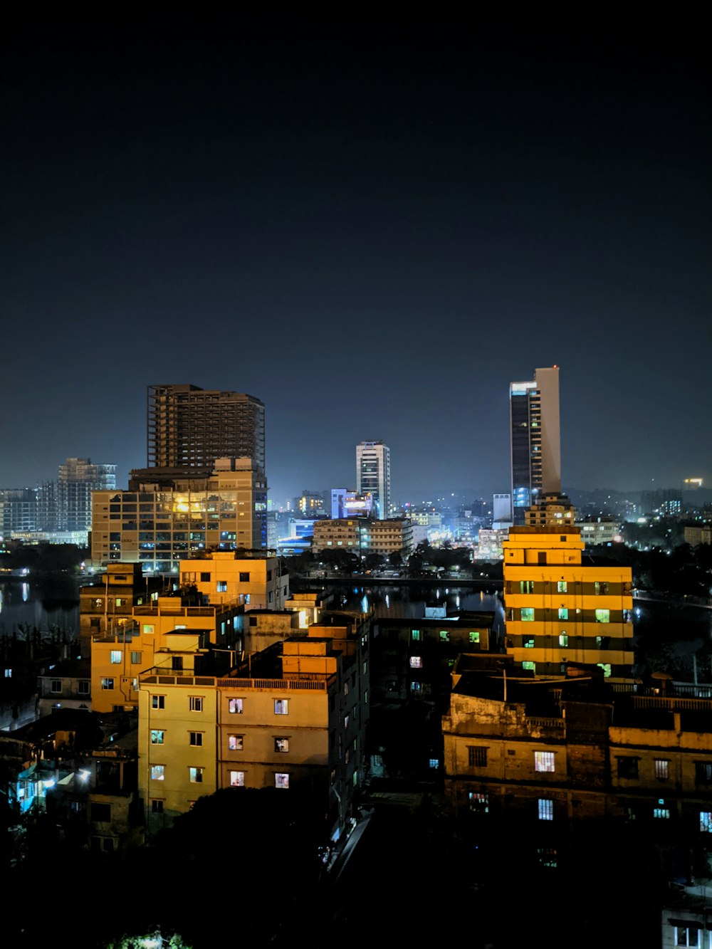 city with high rise buildings during night time