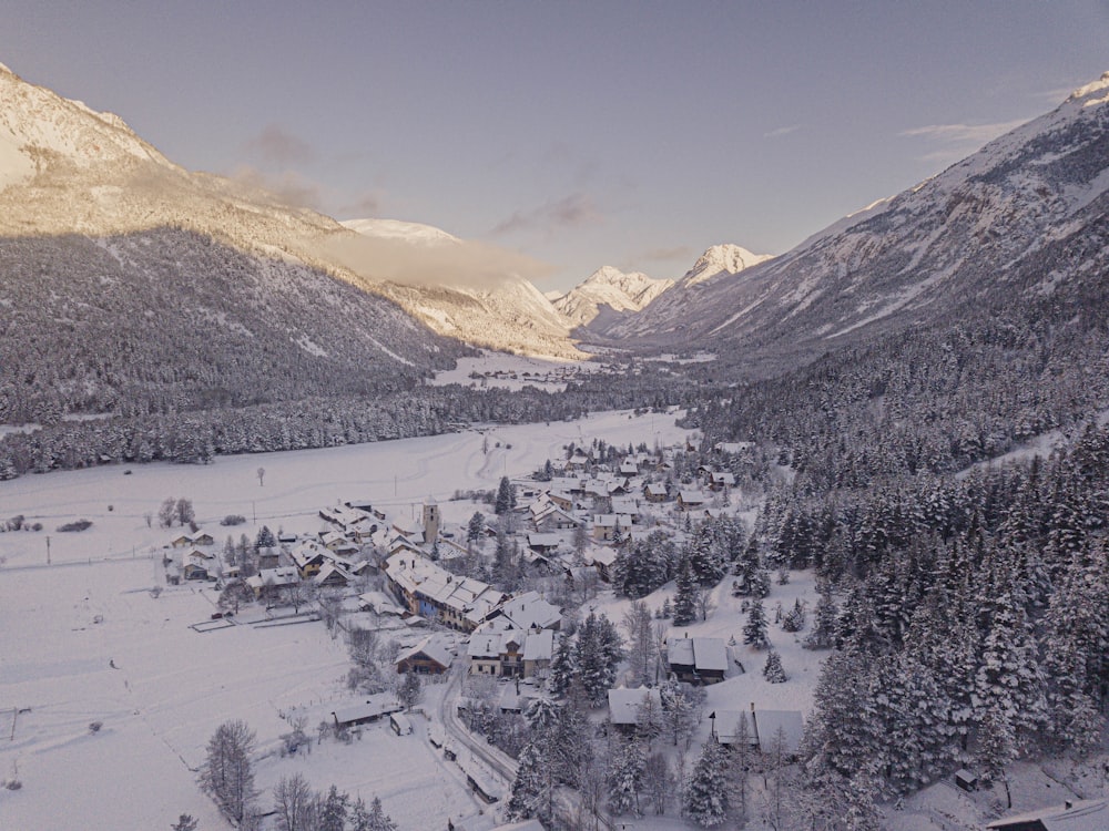 an aerial view of a ski resort surrounded by mountains