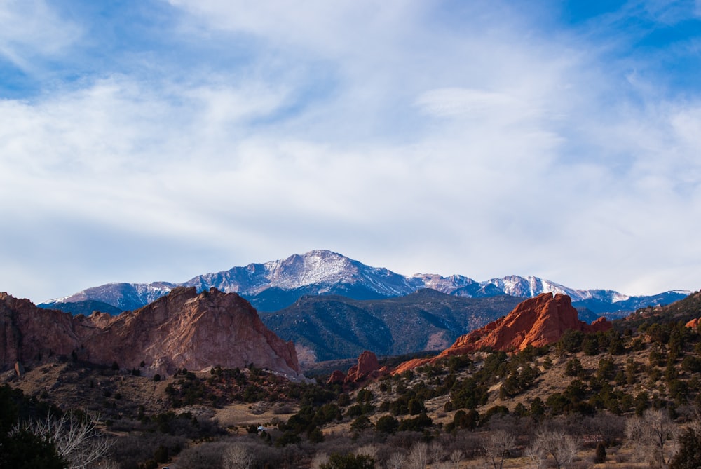 brown rocky mountain under white cloudy sky during daytime