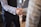 Close-up of hands shaking in agreement over a business contract.