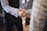 A professional handshake symbolizing trust and partnership in a corporate setting.