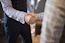 Man shaking hands with a professional, showing confidence and reliability.