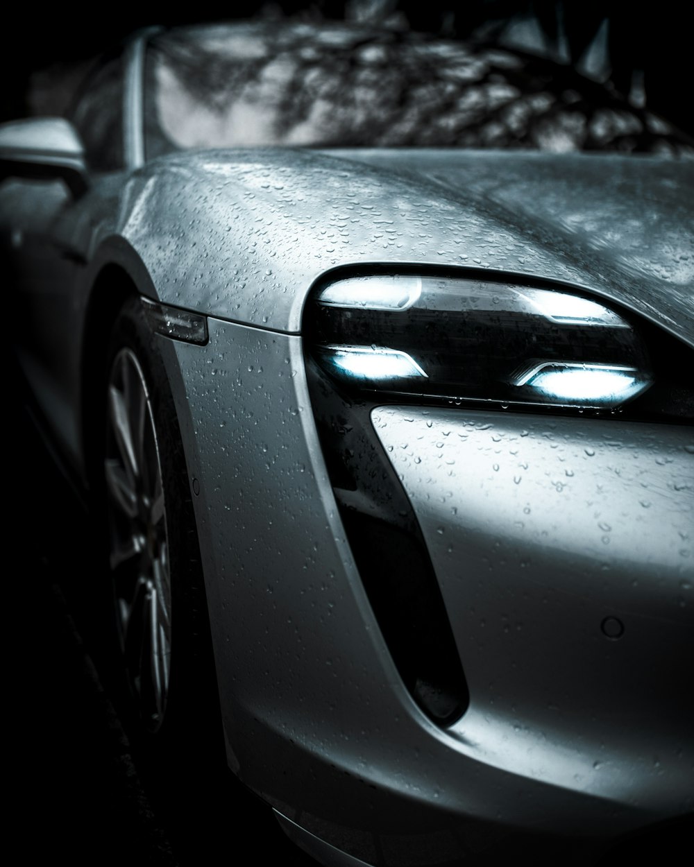 grayscale photo of car in front of house