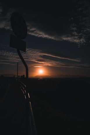 A sunrise over a distant horizon representing new destinations ahead.