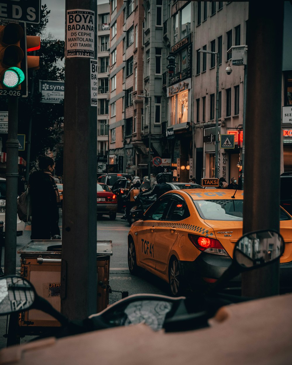 yellow taxi cab on road during daytime