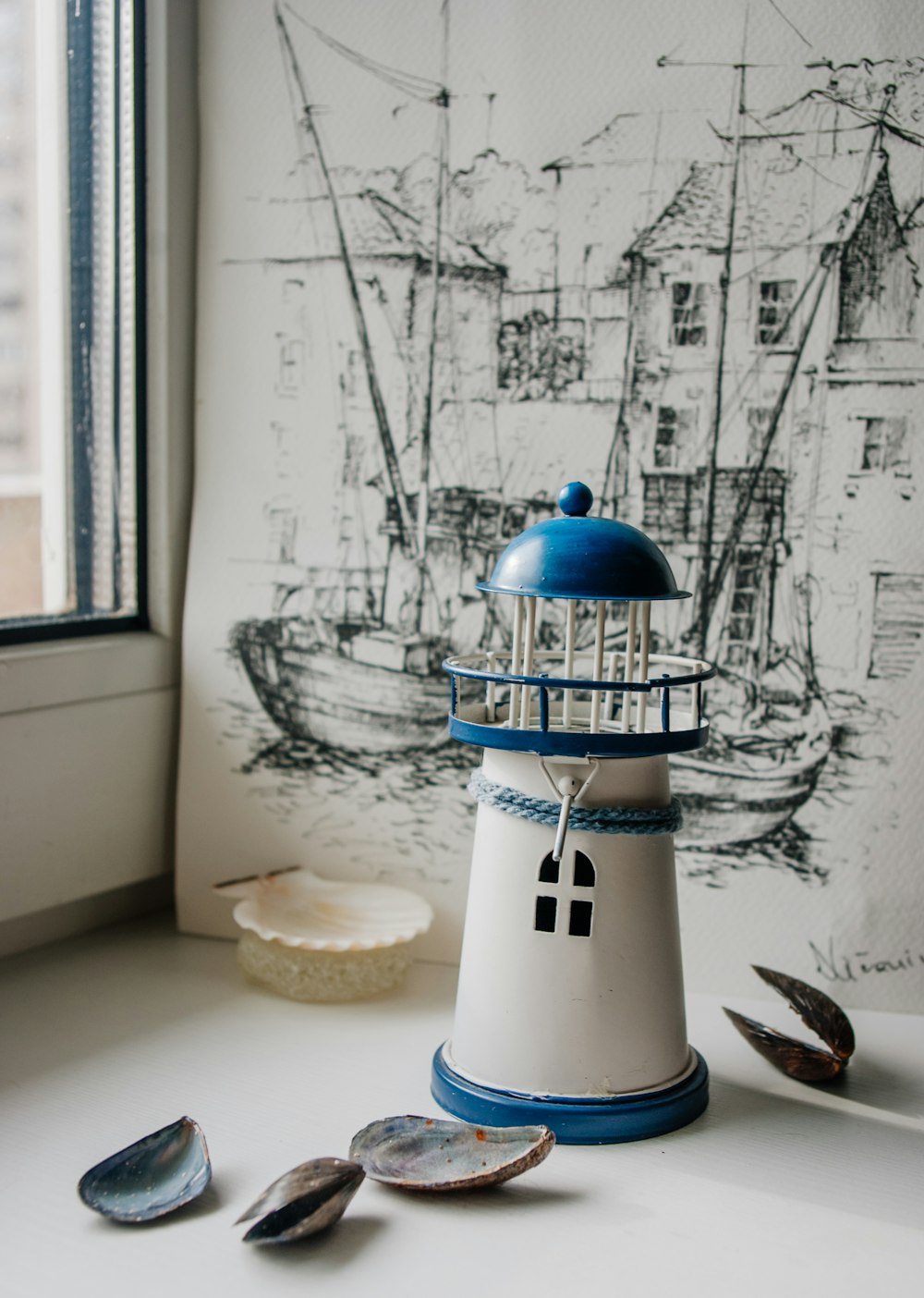 white and red lighthouse miniature