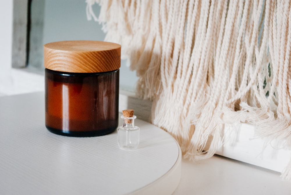 clear glass mug on brown wooden table