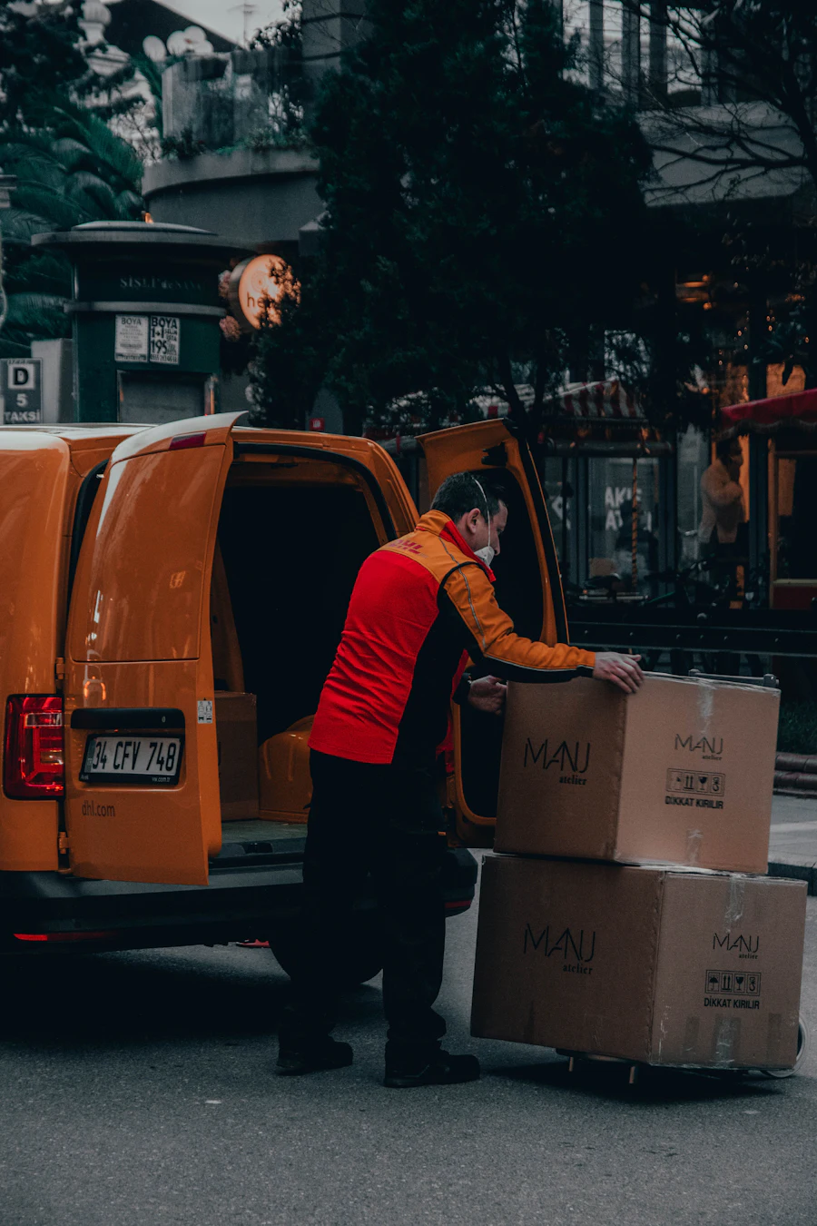 Driver standing beside a van ready for a scheduled delivery run