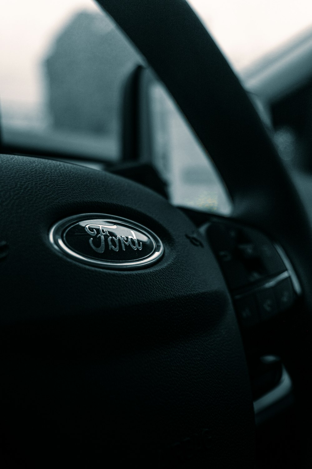 black nissan car steering wheel