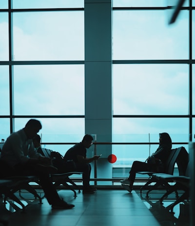 people sitting on chair near window