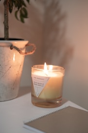 white candle on white table