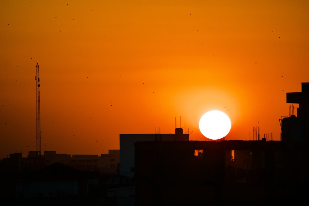 silhouette of building during sunset