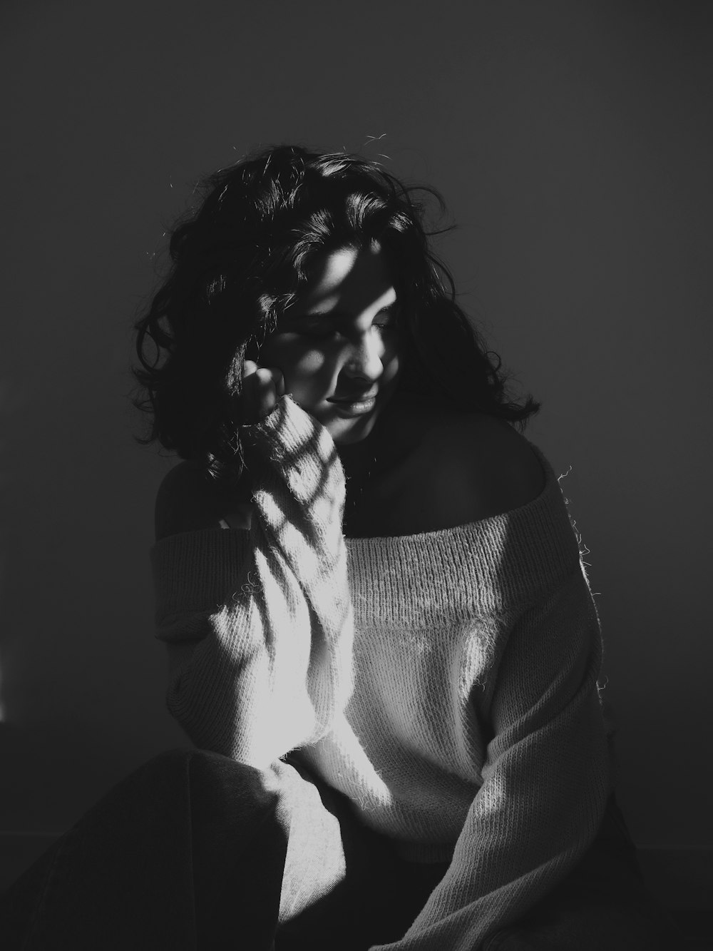 grayscale photo of woman in sweater