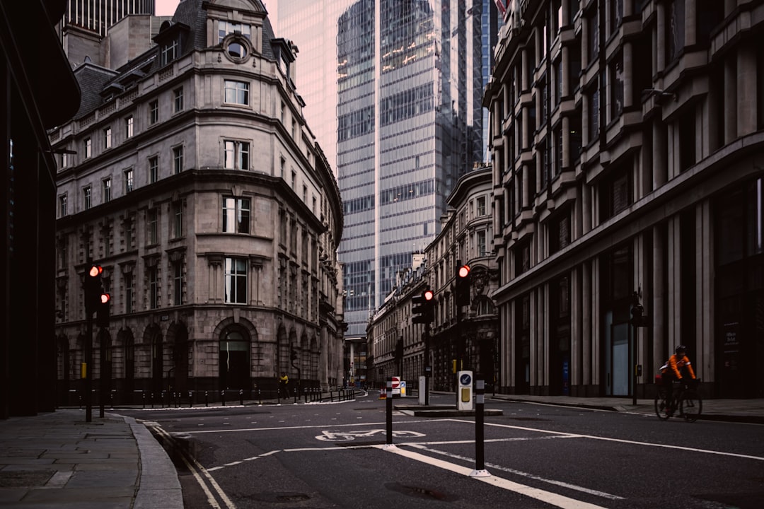 gray concrete building beside gray concrete road during daytime