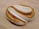 A warm loaf of freshly baked bread on a rustic wooden table.