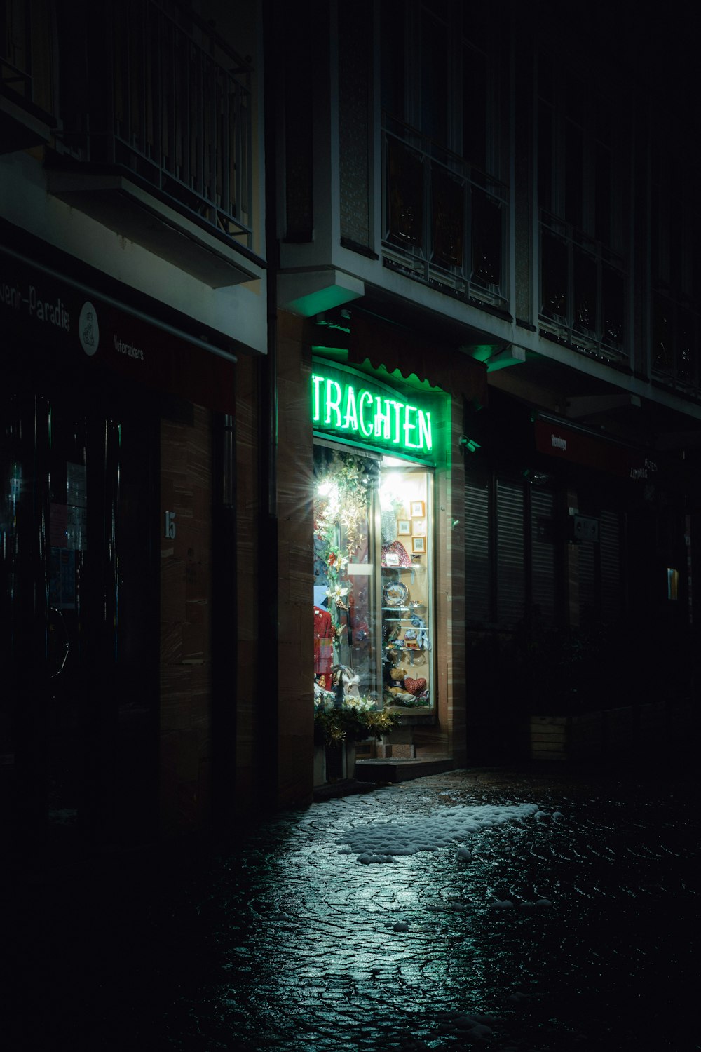 green and white store signage