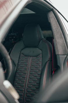 black car steering wheel in car