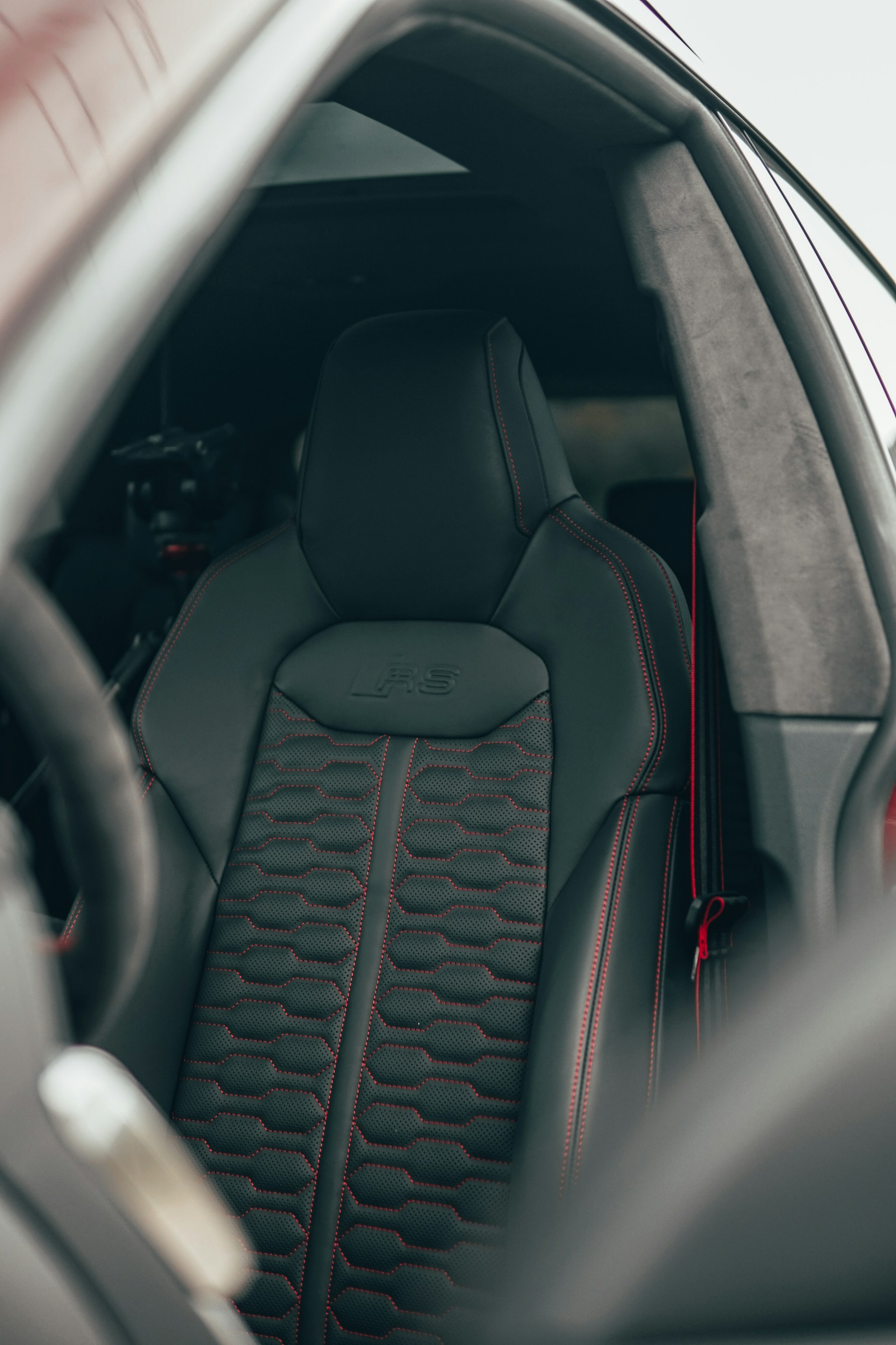 black car steering wheel in car