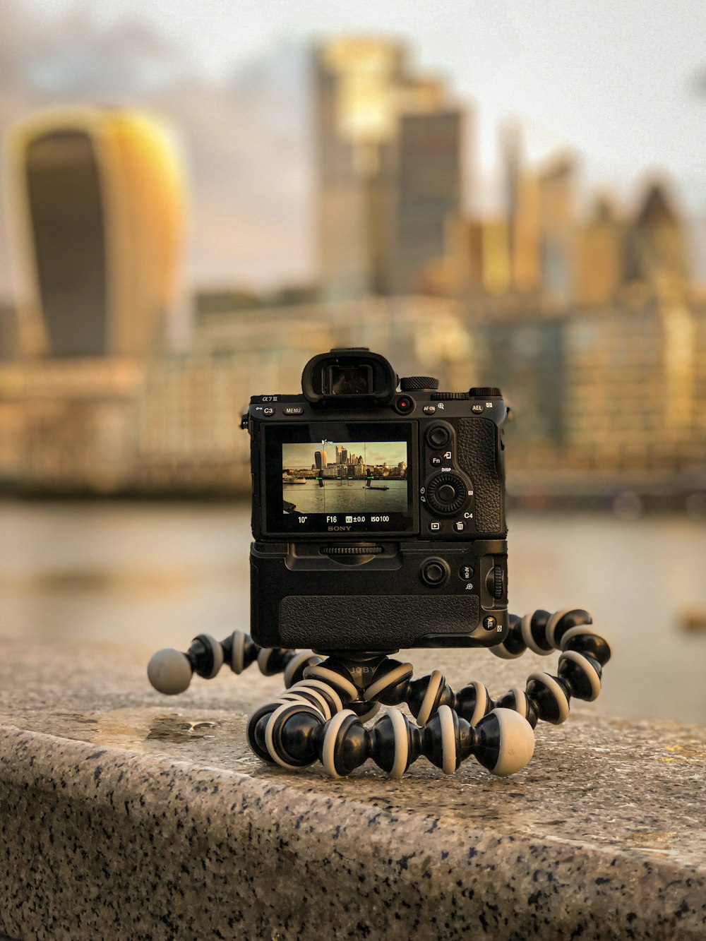 black camera on brown wooden table