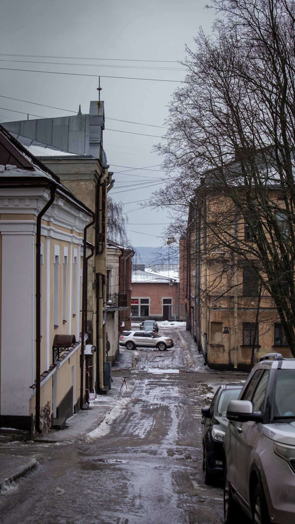 cars parked on side of road during daytime