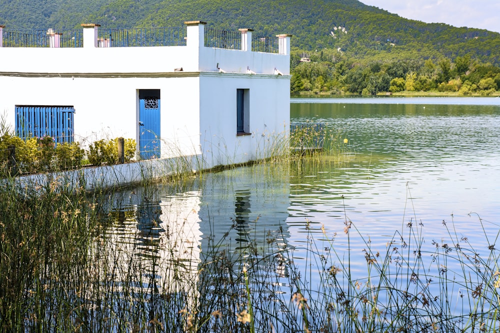 white concrete building near body of water during daytime