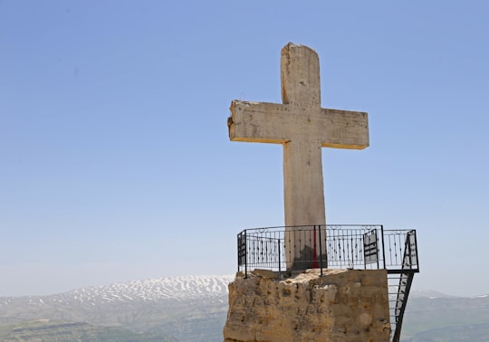 brown cross on brown rock formation during daytime in Laqlouq Lebanon