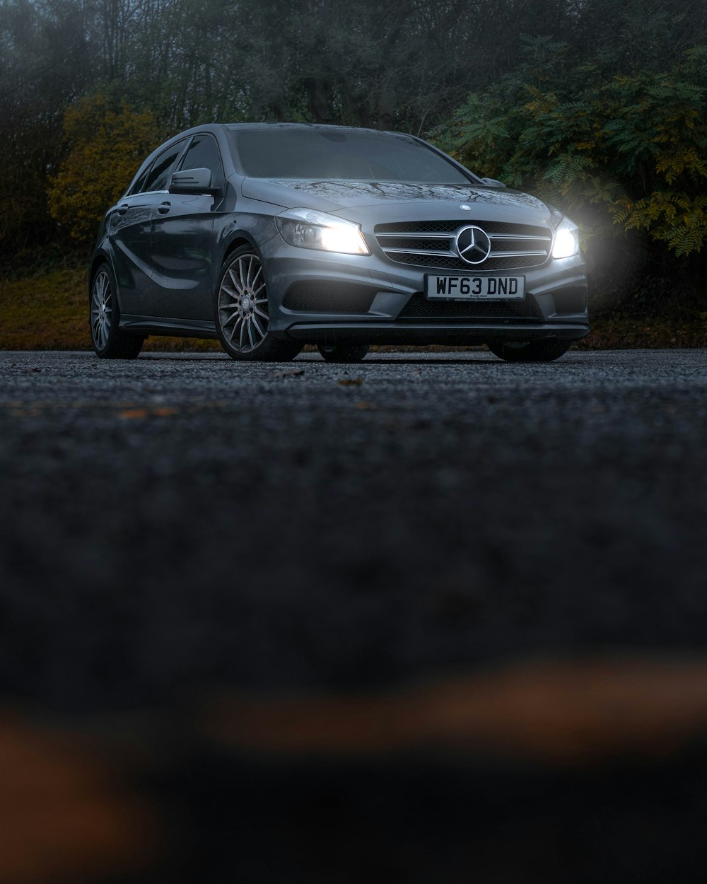 black mercedes benz coupe on road