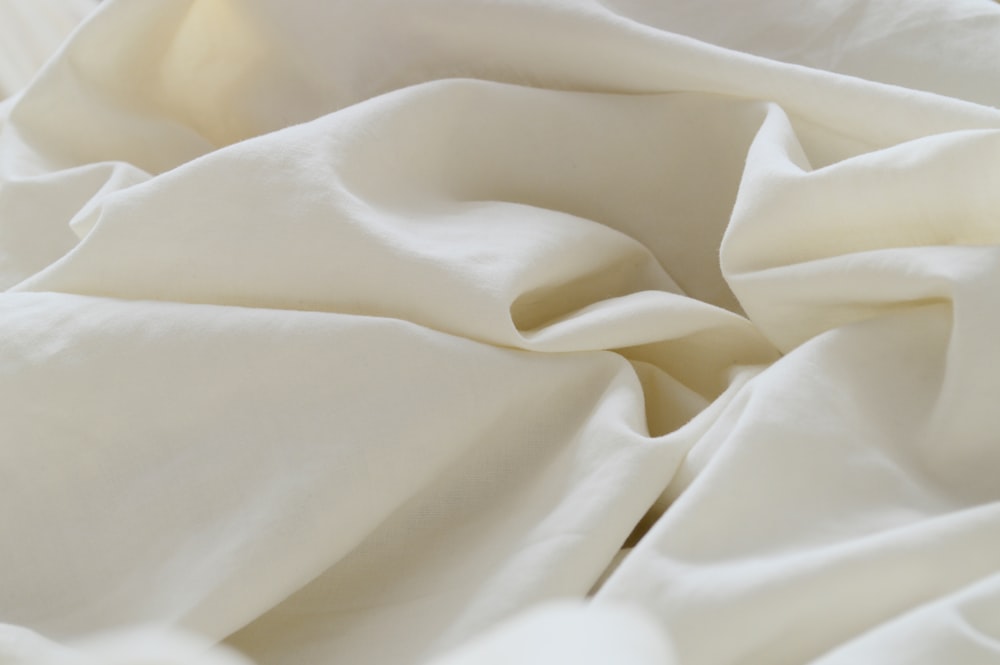 white textile in close up photography