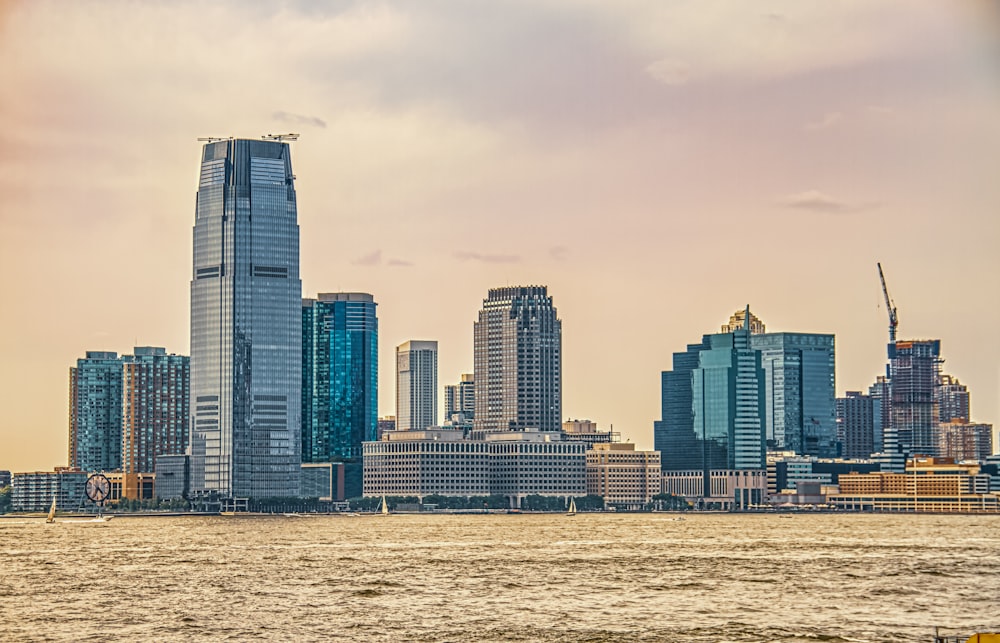 city skyline under white clouds during daytime