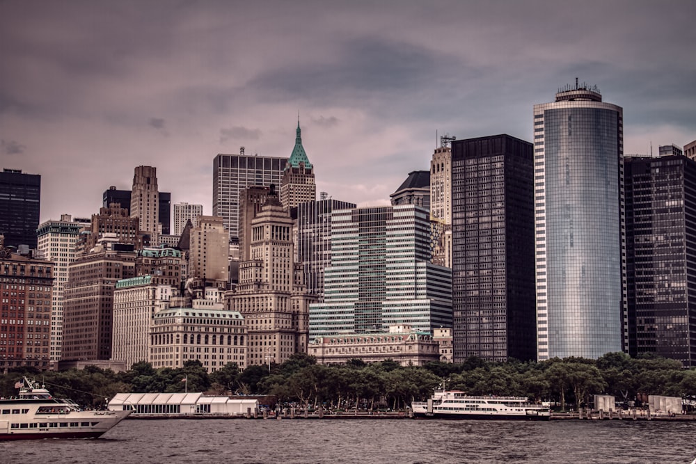 city buildings near body of water during daytime