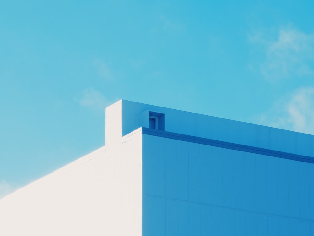 blue and white concrete building under blue sky during daytime