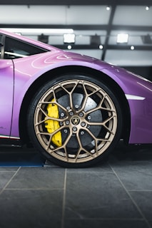 purple car with silver wheel