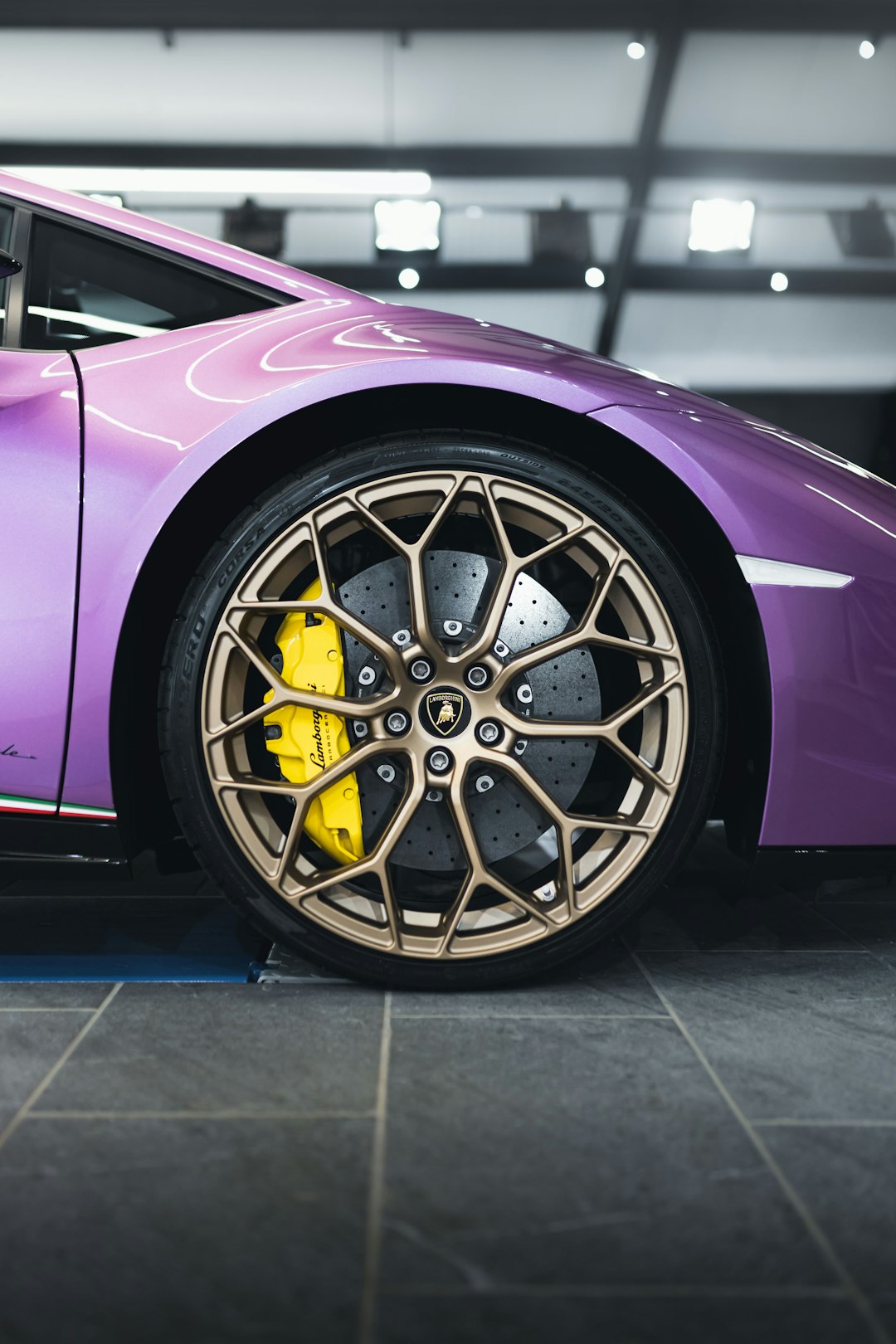 purple car with silver wheel