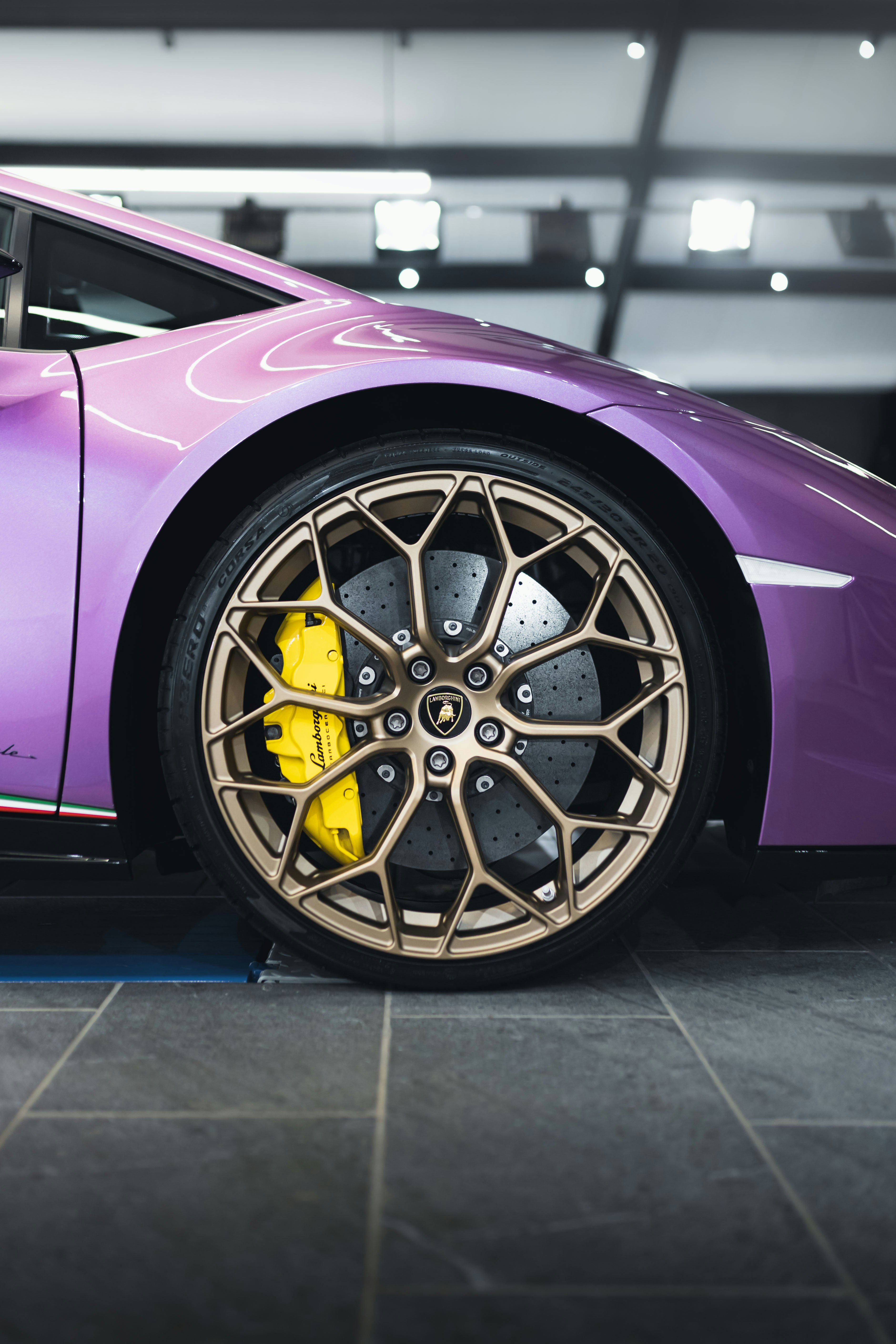 purple car with silver wheel