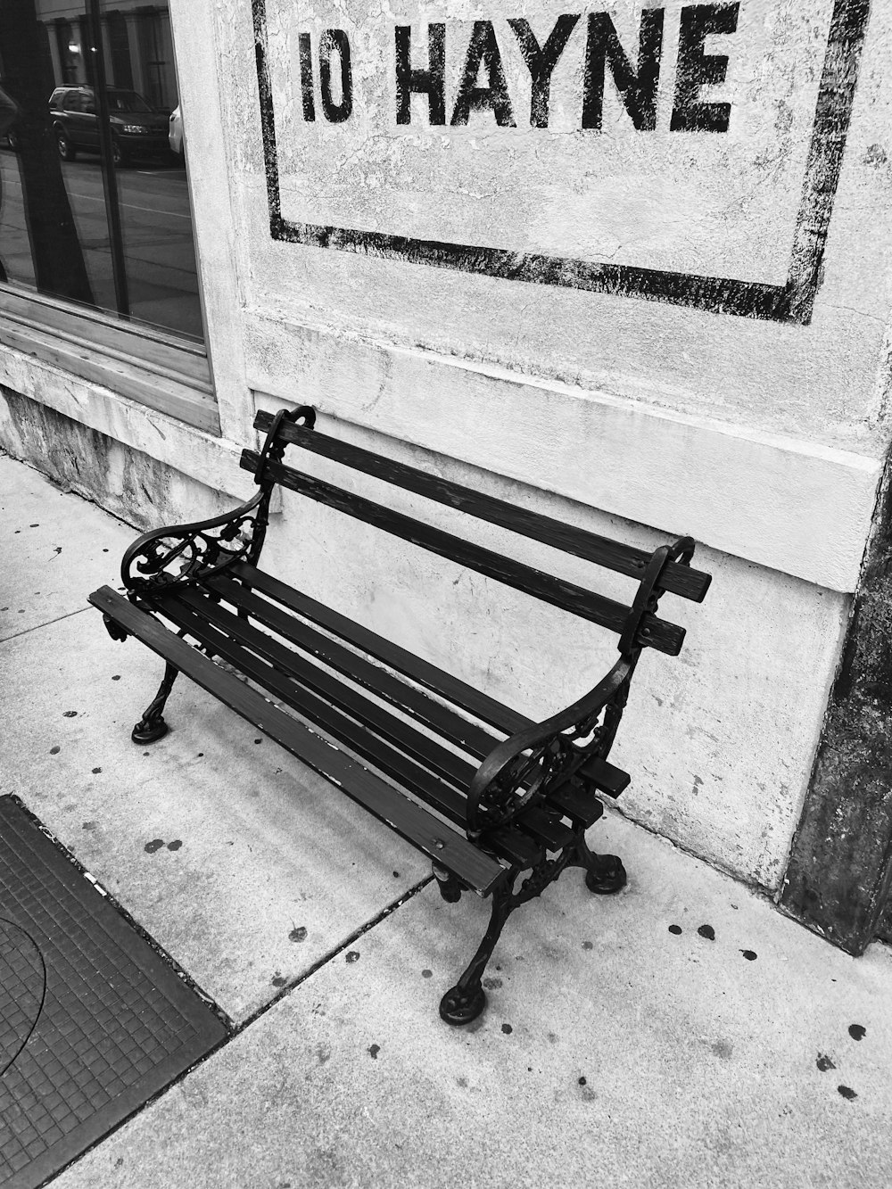 black wooden bench on gray concrete floor