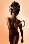 woman in black brassiere and panty with gold crown