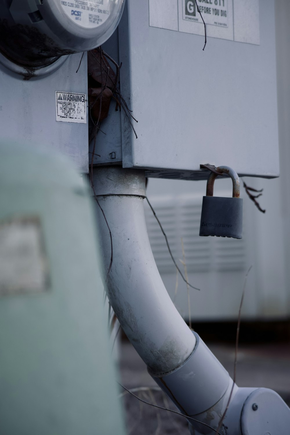 gray padlock on gray pipe