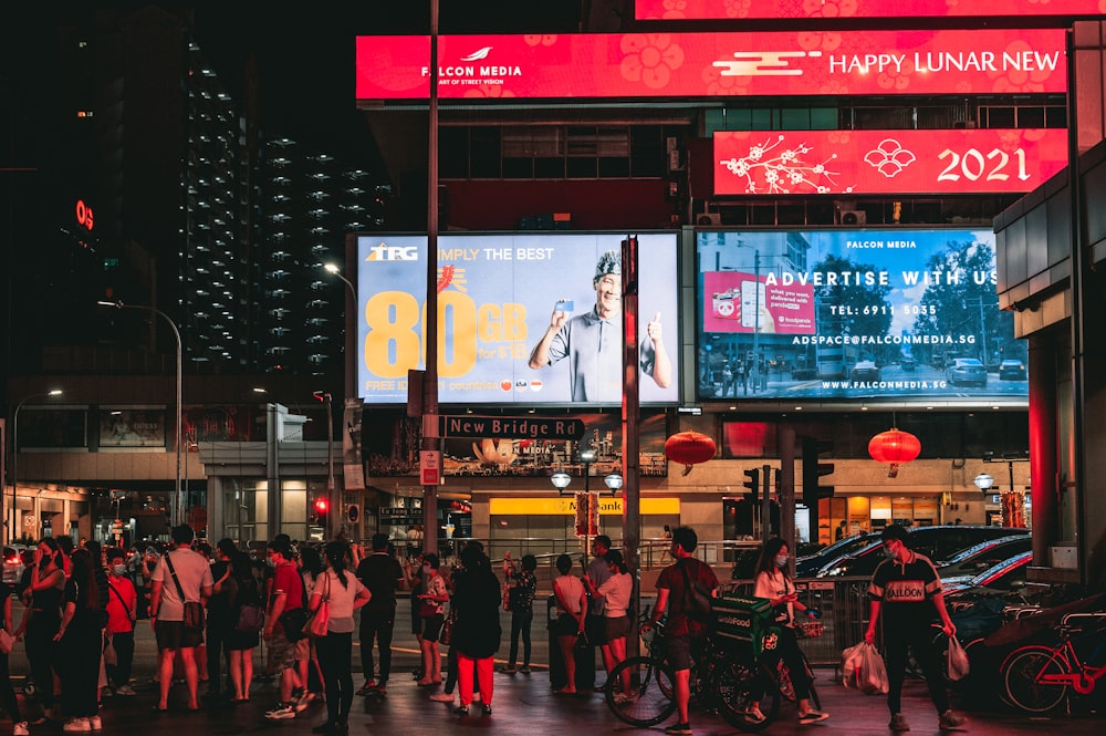 people walking on street during nighttime