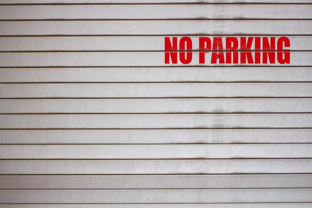 a no parking sign on a garage door