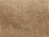 Golden thread detail on a gray polypropylene sack highlighting material strength.