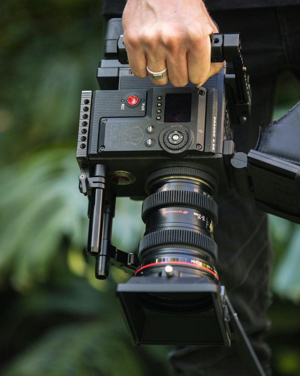 person holding black video camera